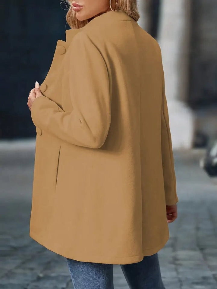 back view of camel longline coat showing stand collar and tailored fit