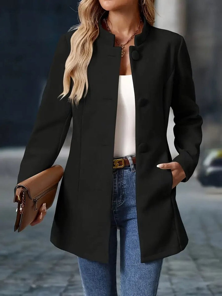 black open-front longline coat with stand collar, close-up view