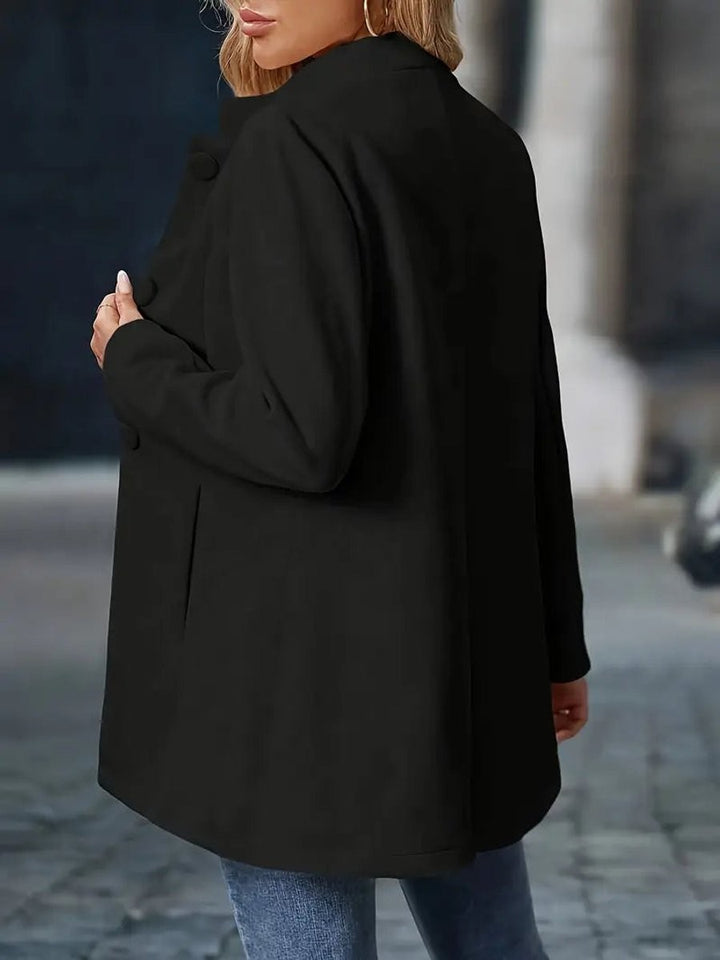 back view of black longline coat blazer with covered button detail