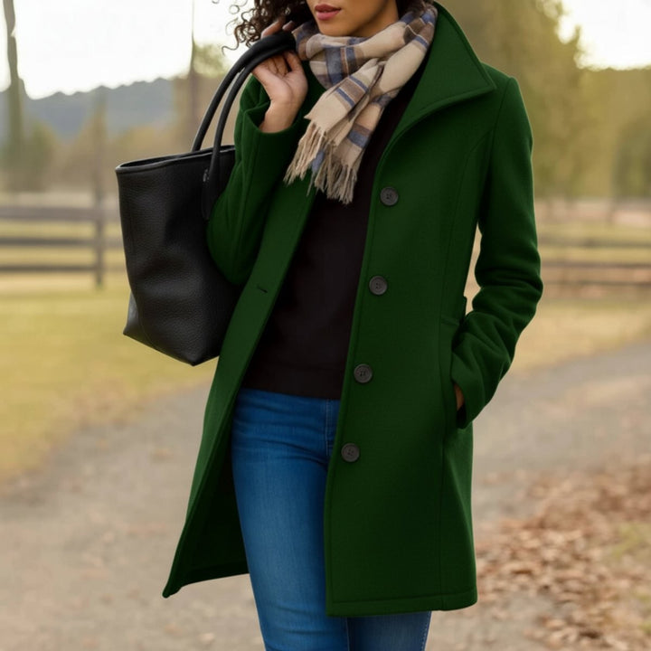 Green single-breasted wool-blend coat styled with plaid scarf and tote bag