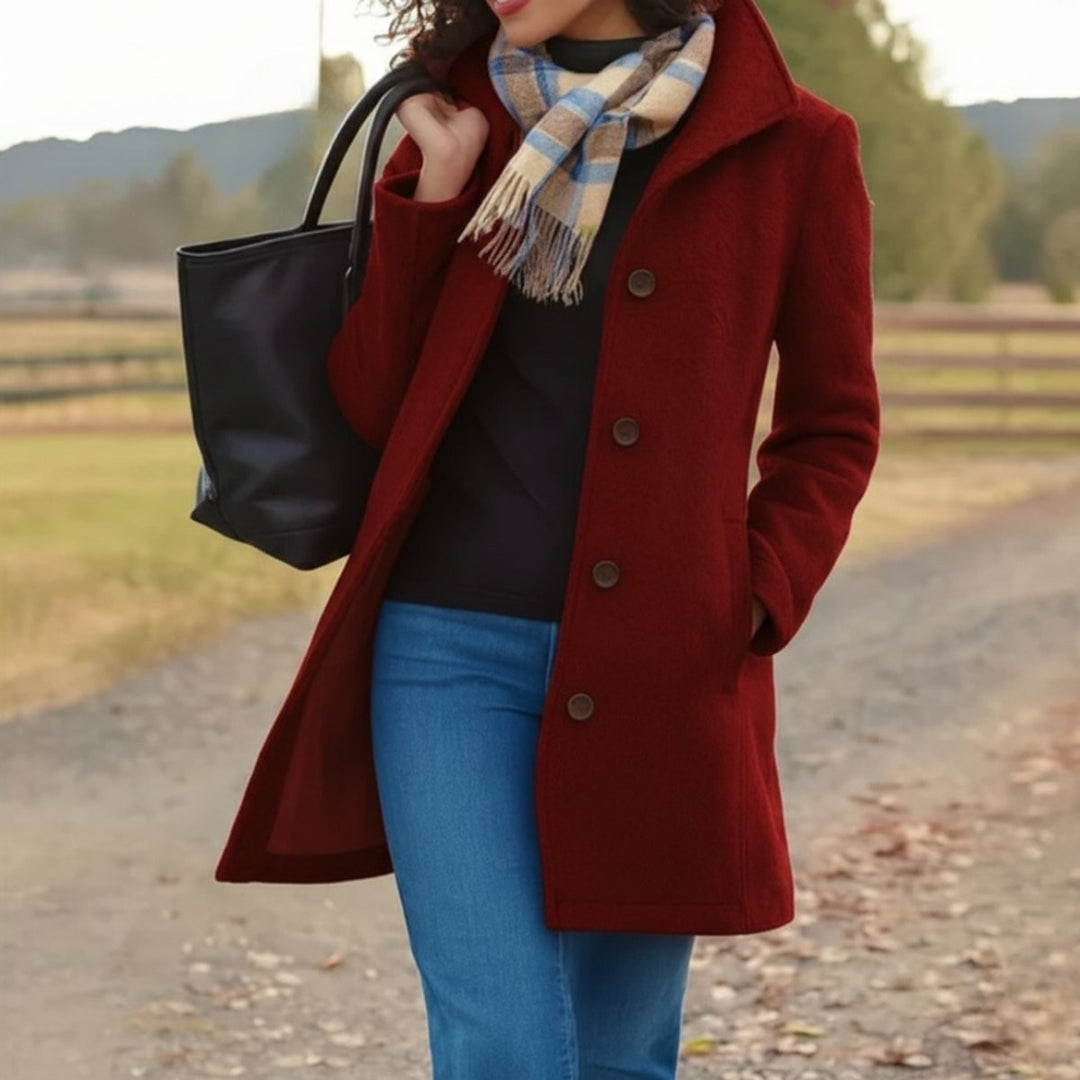 Burgundy single-breasted wool coat paired with plaid scarf and denim jeans