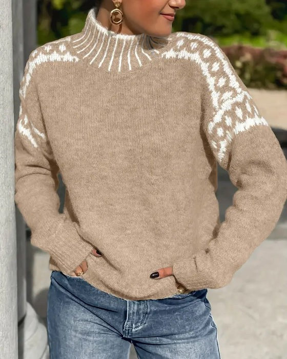 Beige mock neck sweater featuring white leopard-print yoke detail