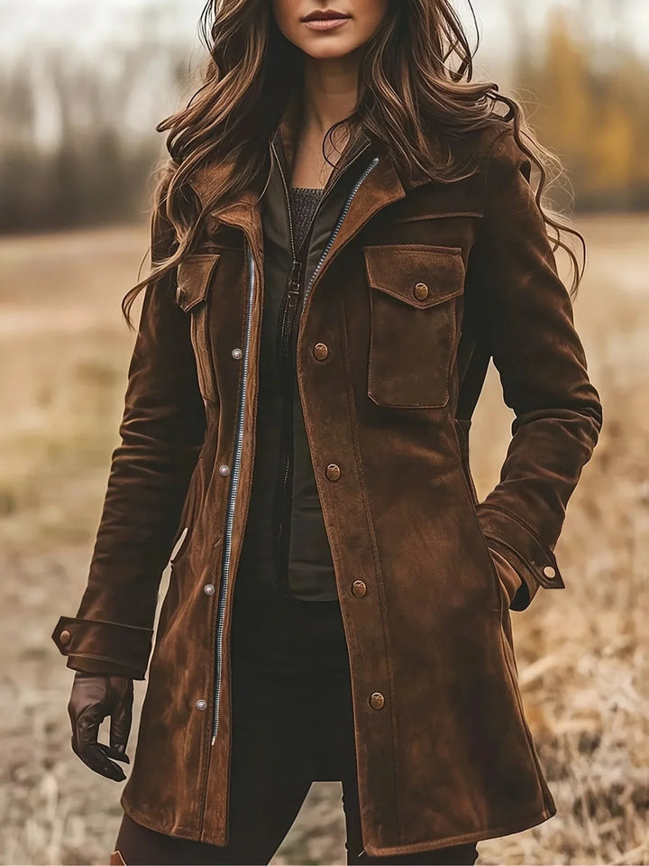 Distressed brown suede coat with flap pockets and zip-front detail worn outdoors