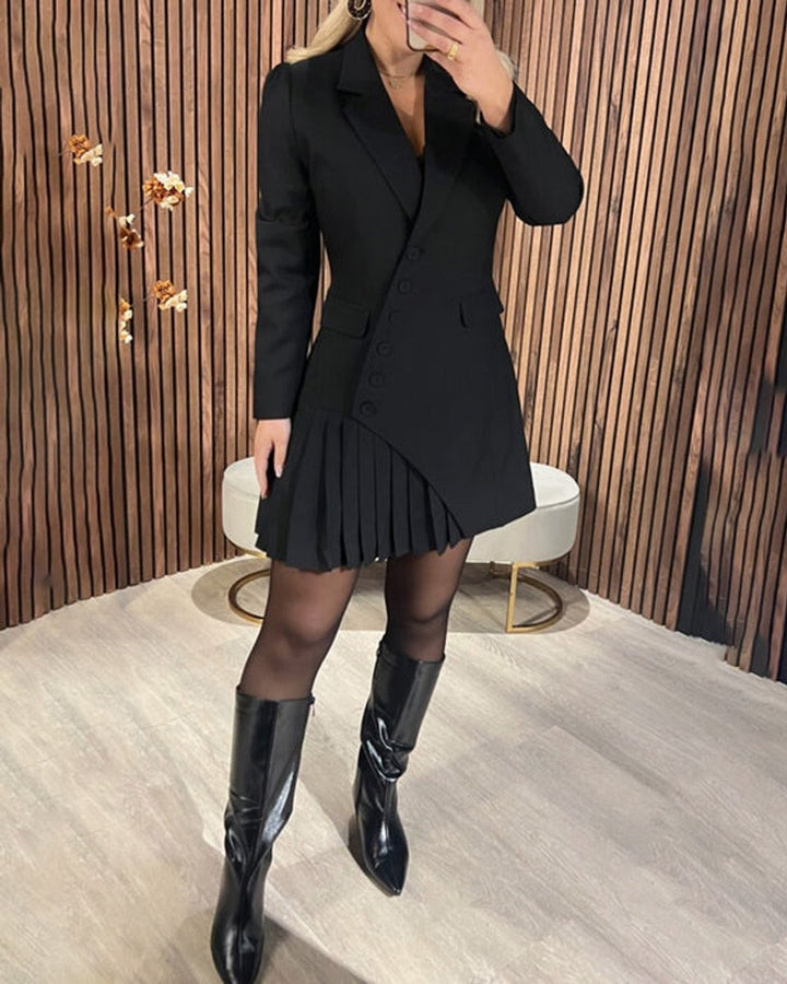 Black pleated blazer dress paired with pointed-toe leather boots