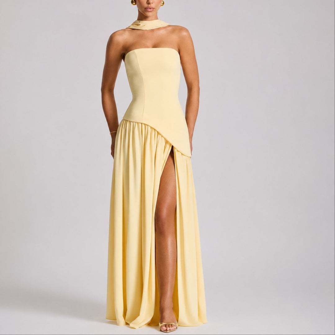 Pale yellow strapless maxi dress with halter scarf detail and thigh-high slit