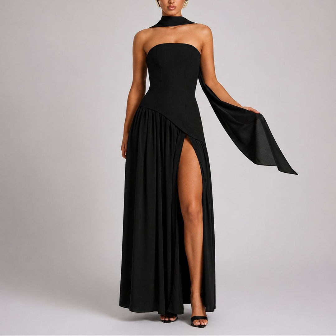 Black strapless evening gown with attached scarf sleeve and high leg slit