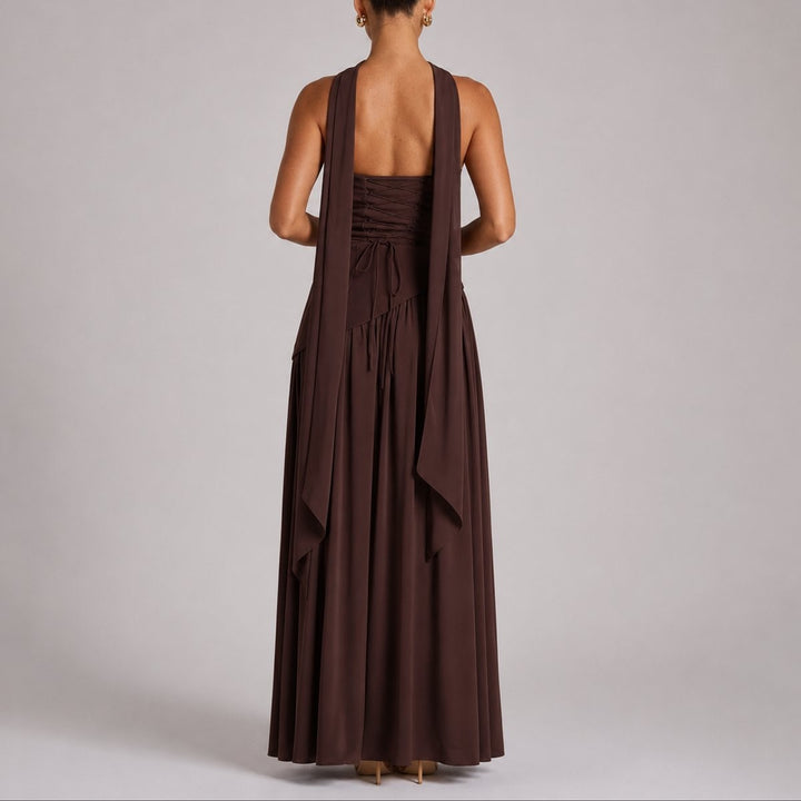 Back view of brown strapless gown showing corset lacing and flowing scarf straps
