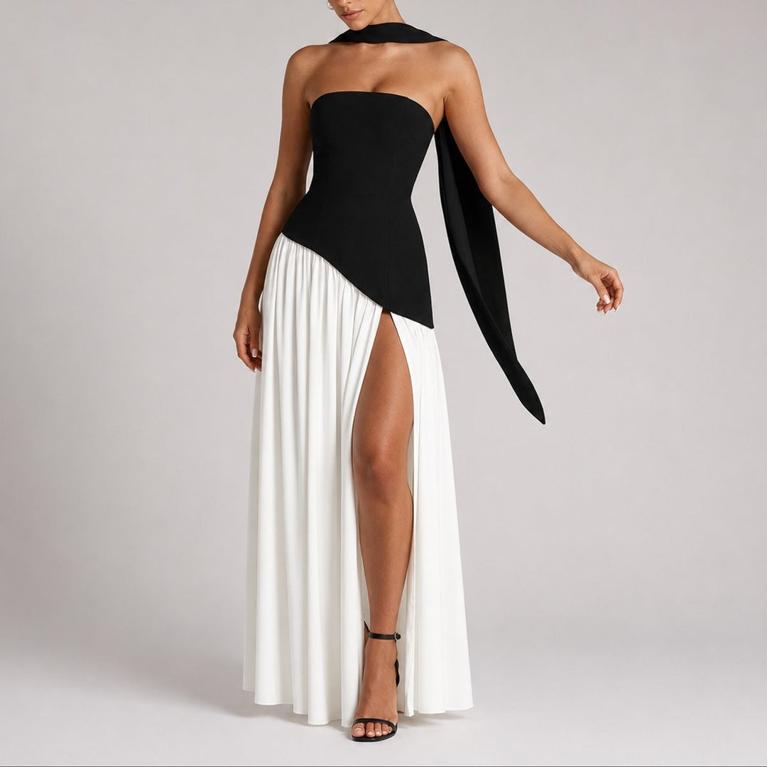 Black and white color-block strapless gown with scarf sleeve and dramatic slit