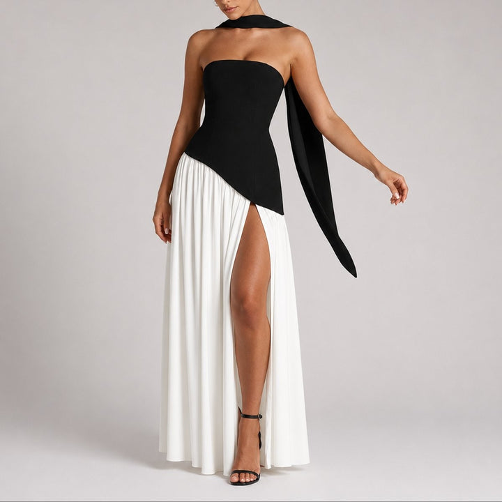 Black and white color-block strapless gown with scarf sleeve and dramatic slit