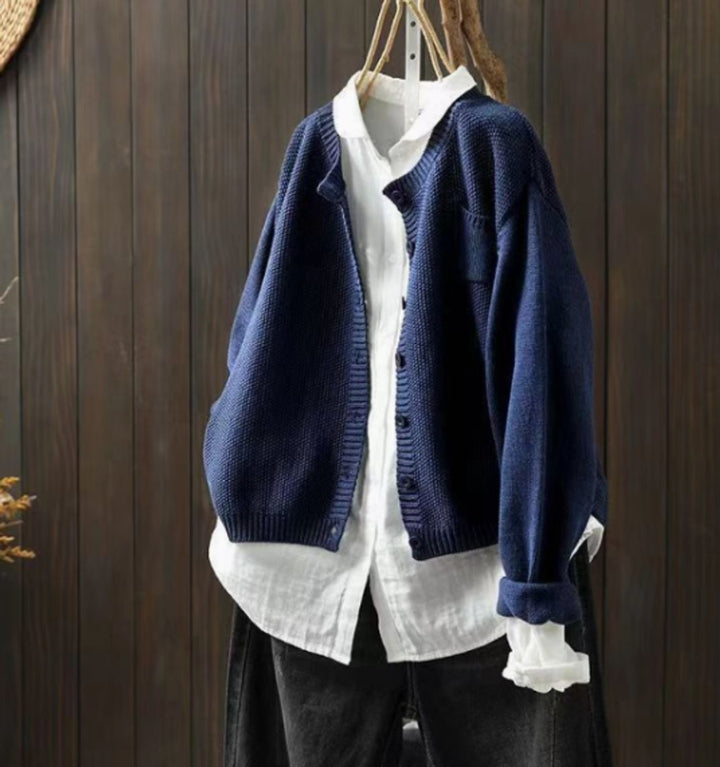 Navy blue oversized cardigan sweater with button placket and side pocket