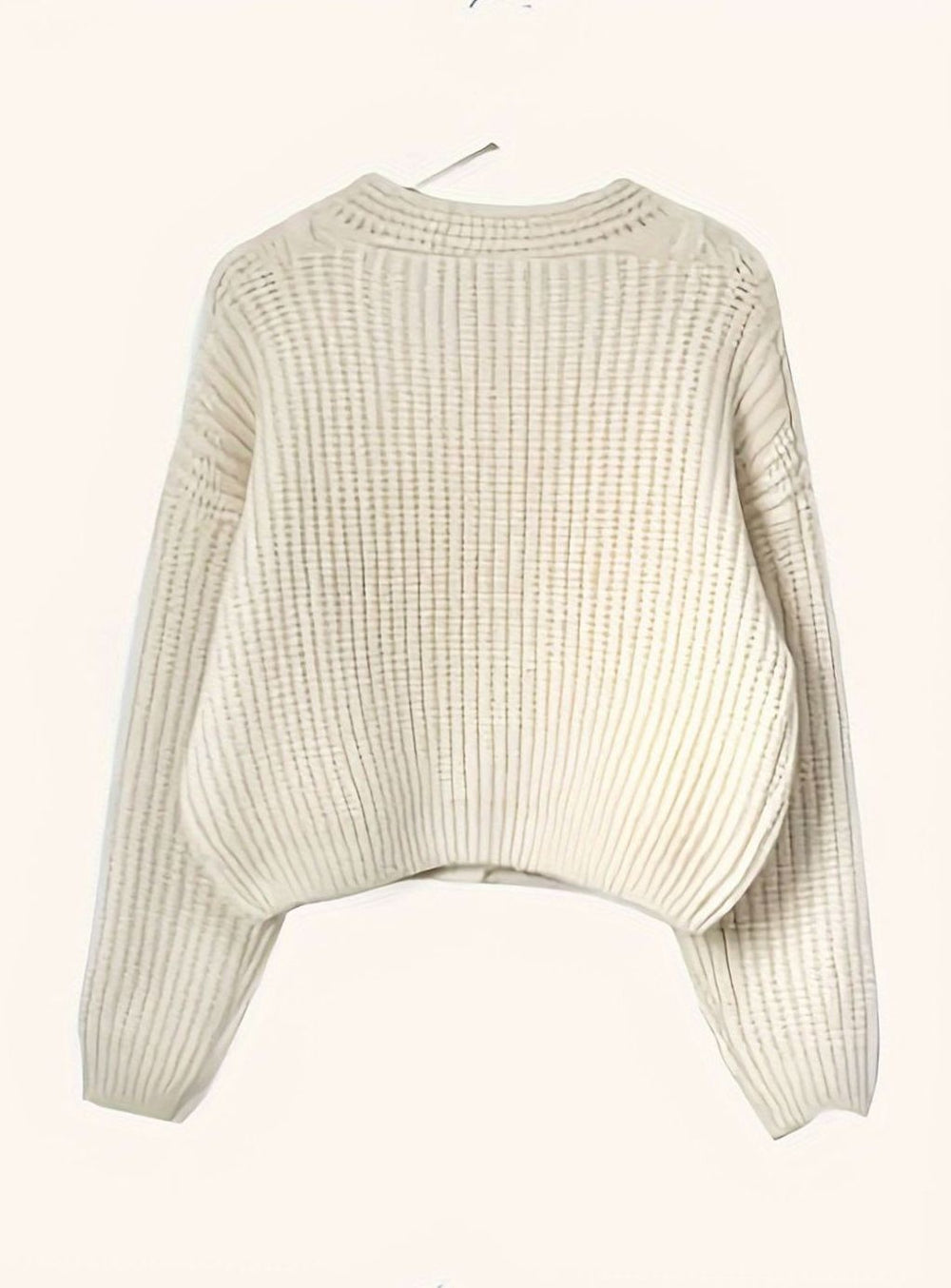 ivory ribbed knit cardigan laid flat showing cropped oversized silhouette