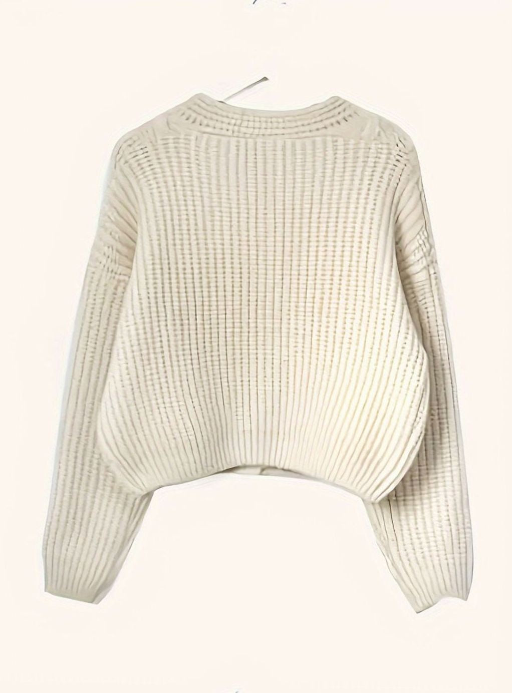 ivory ribbed knit cardigan laid flat showing cropped oversized silhouette