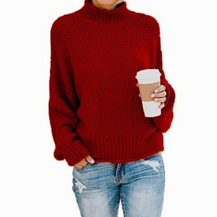 Red chunky knit mock neck sweater featuring ribbed hem and cuffs