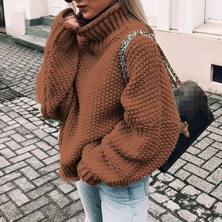 Camel brown oversized chunky knit turtleneck sweater with leopard print strap detail