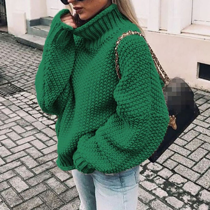 Green oversized chunky knit turtleneck sweater featuring dropped shoulders and ribbed cuffs