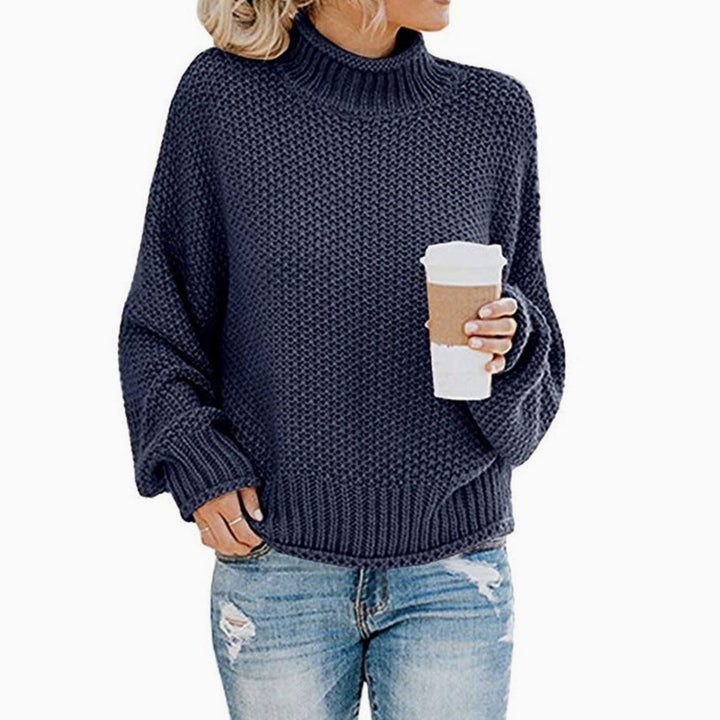Navy blue chunky knit mock neck sweater with dropped shoulder batwing sleeves