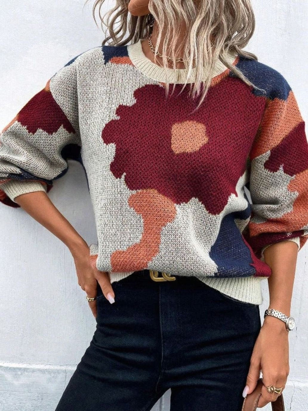 Relaxed-fit pullover sweater with burgundy floral pattern and rust accents