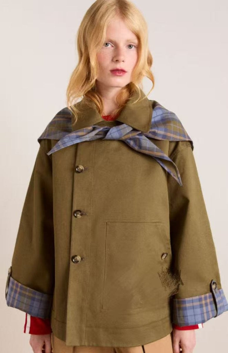 front view of olive double-breasted trench coat with plaid scarf collar