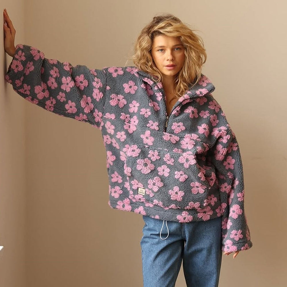 oversized pink floral sherpa pullover styled with straight-leg denim jeans