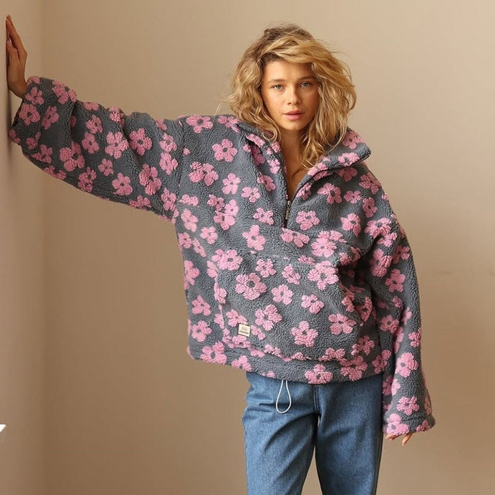 oversized pink floral sherpa pullover styled with straight-leg denim jeans