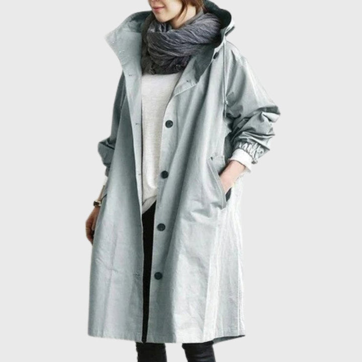 Light gray hooded trench coat styled with a knit infinity scarf