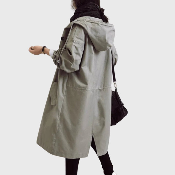 Sage green hooded trench coat shown from the back with drawstring hood