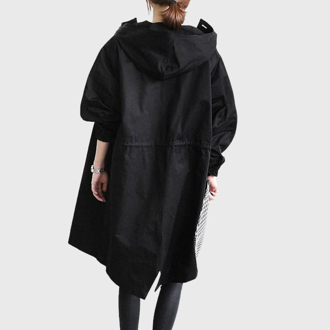 Black hooded long trench coat back view with asymmetrical hem