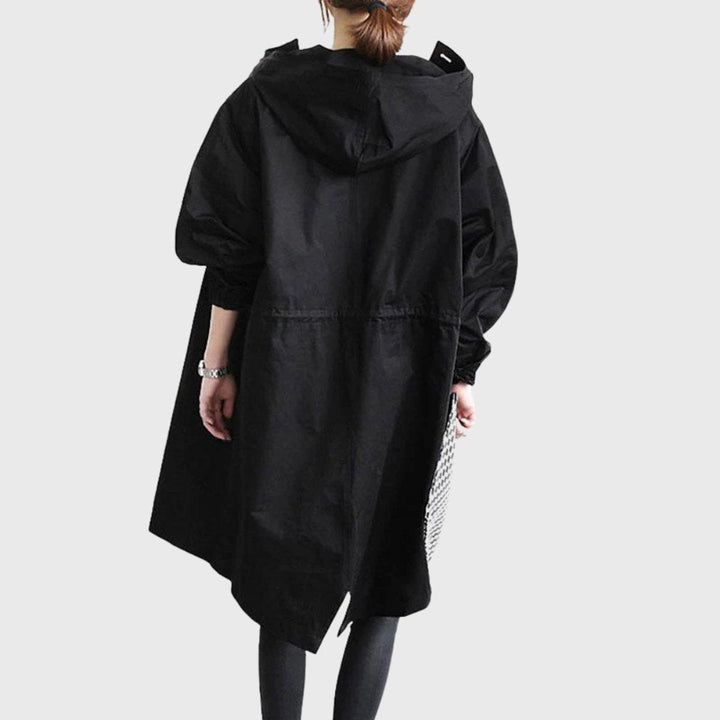 Black hooded long trench coat back view with asymmetrical hem