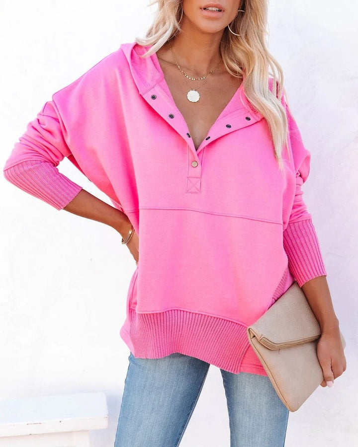 Bright pink oversized hoodie with snap placket and ribbed hem detail