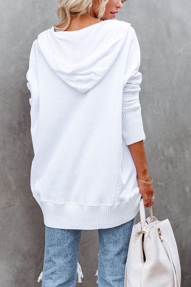 Back view of white hooded sweatshirt with drop shoulders and ribbed hem