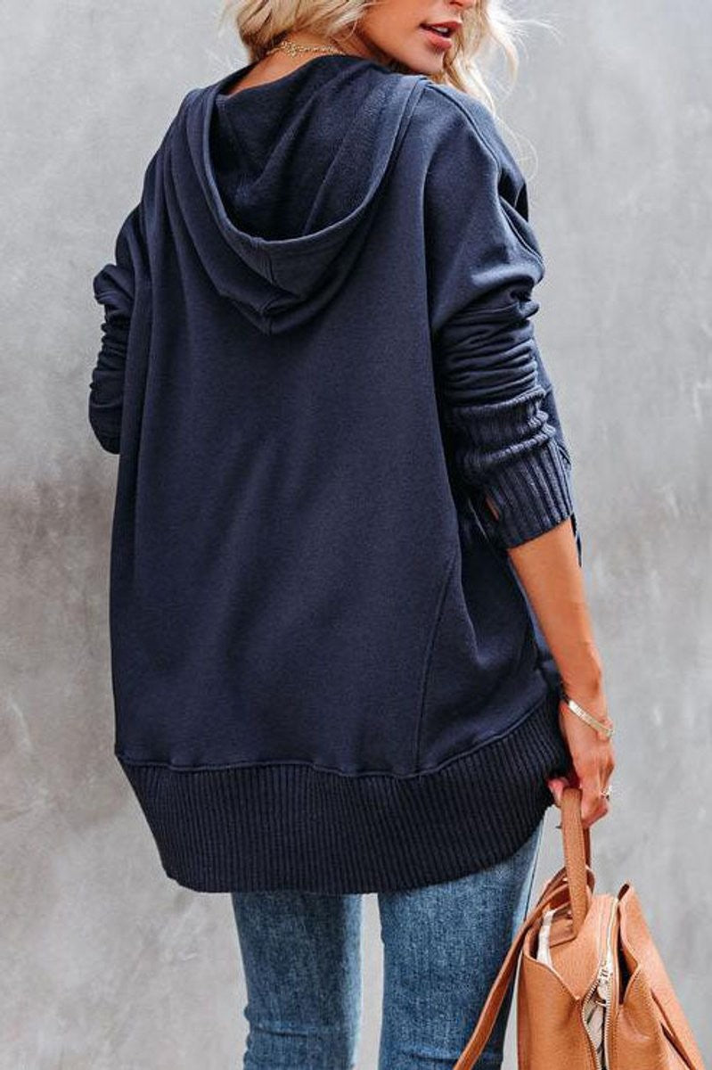 Back view of navy hoodie showing ribbed hem and relaxed silhouette