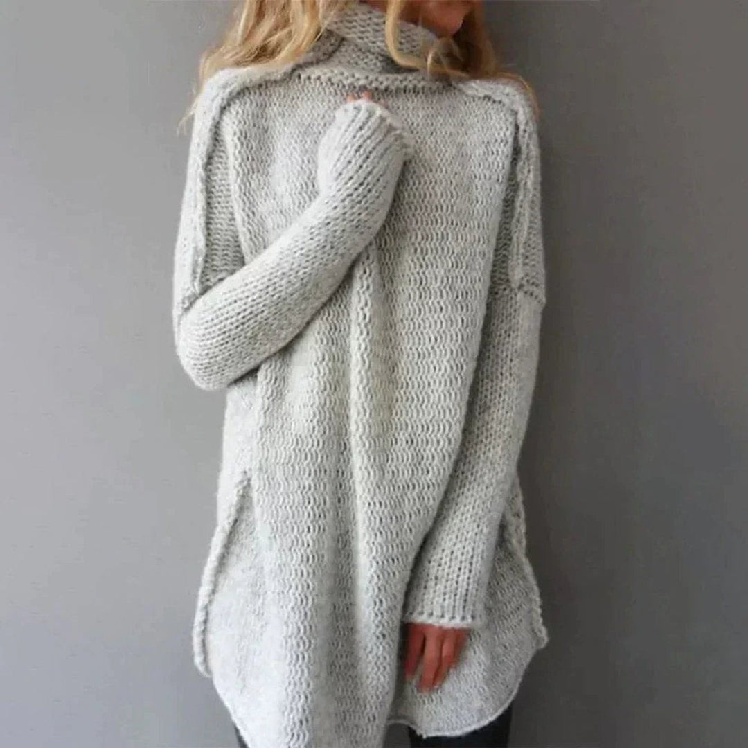 Back view of gray oversized turtleneck sweater in chunky knit
