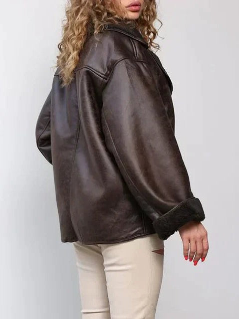 Oversized brown leather jacket with sherpa lining, back view detail