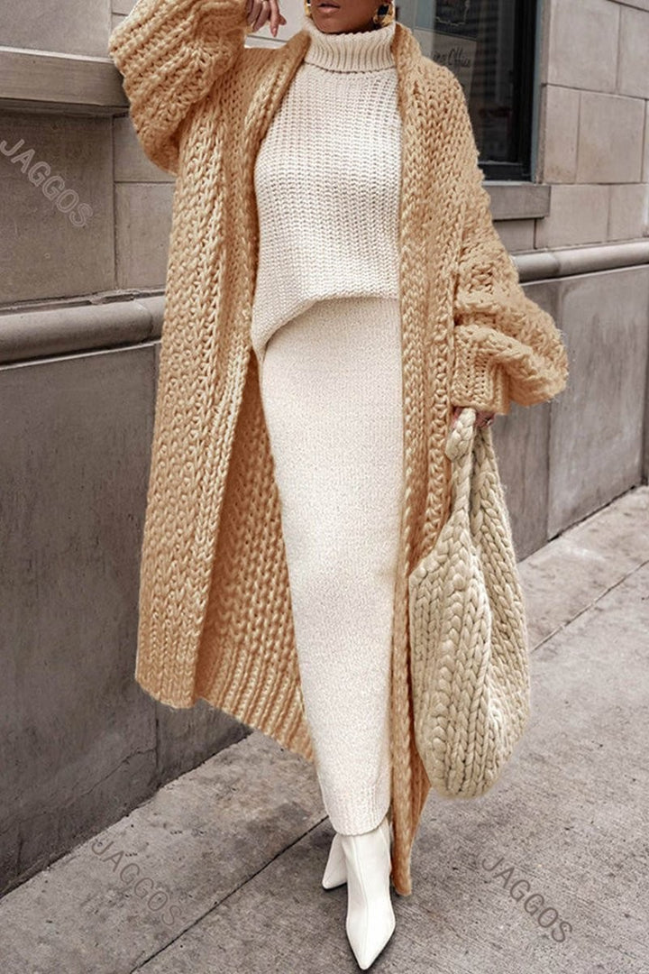 Camel chunky knit long cardigan layered over cream turtleneck sweater set