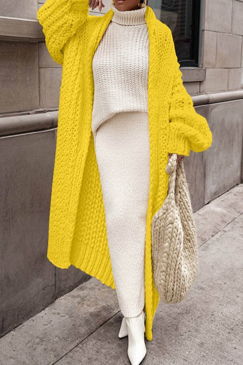 Yellow chunky knit longline cardigan layered over cream turtleneck sweater set