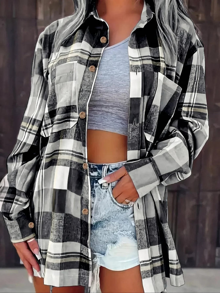 Black and white plaid flannel shirt with button-up front and long sleeves