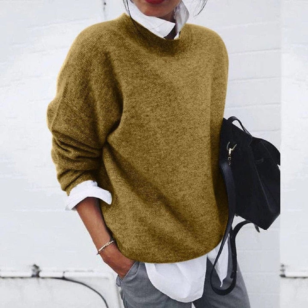 Mustard yellow knit sweater styled with white shirt and gray trousers