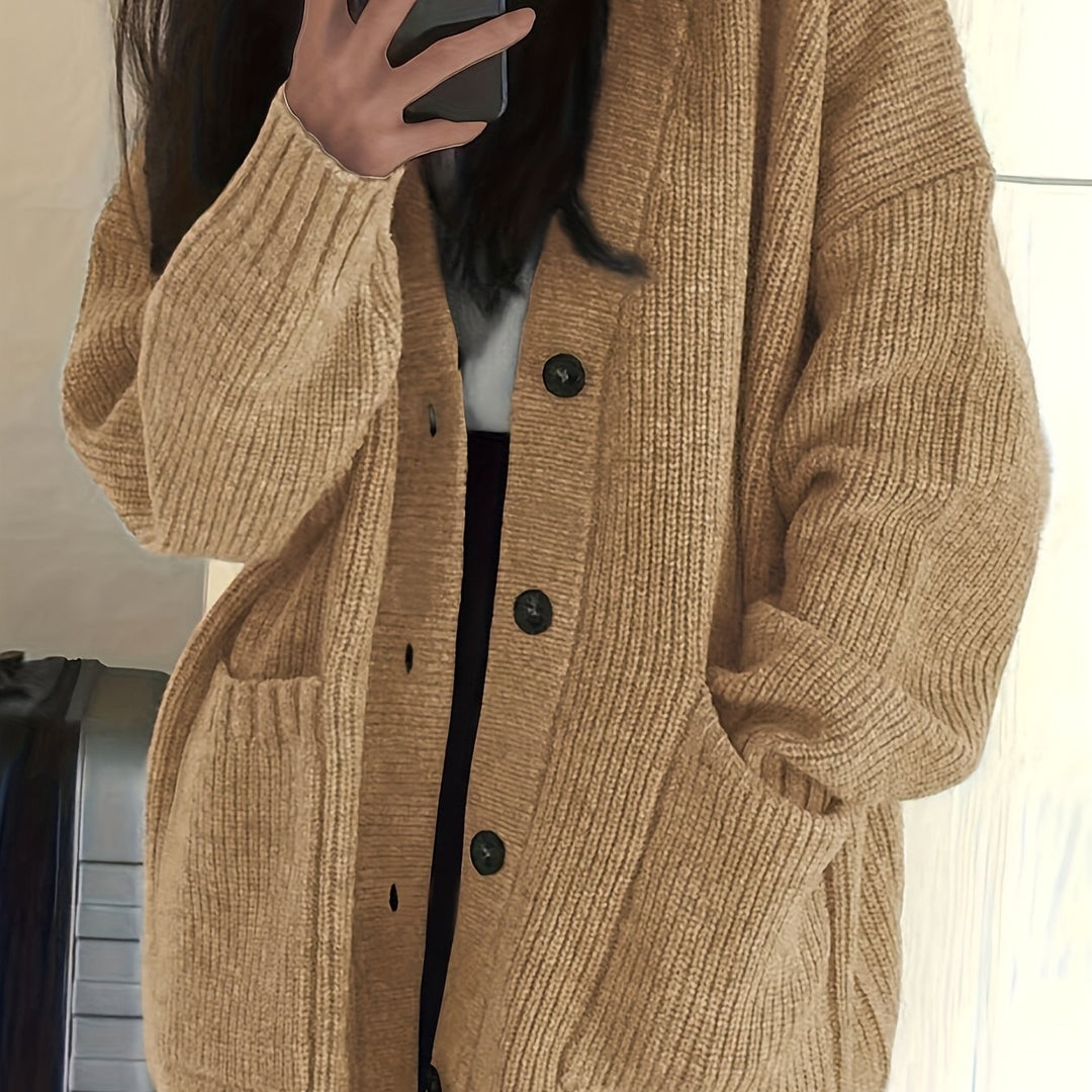 Camel ribbed cardigan close-up showing knit texture and buttons