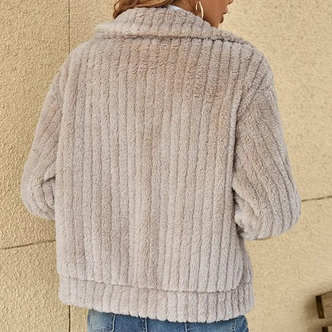 Back view of light gray ribbed faux fur jacket with collared design