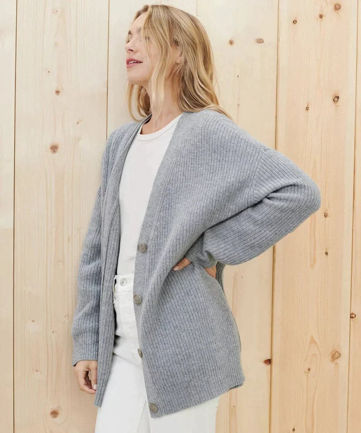 Heather gray V-neck cardigan paired with white denim jeans