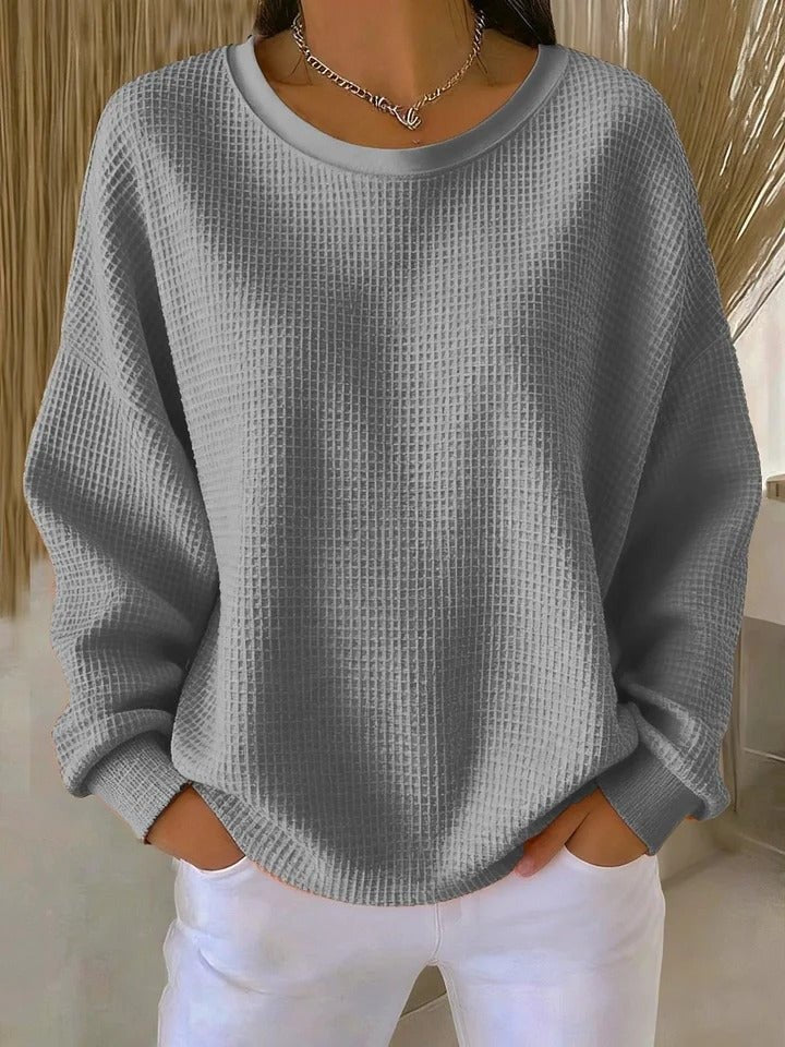 Gray waffle-knit pullover sweater with relaxed oversized fit and ribbed cuffs