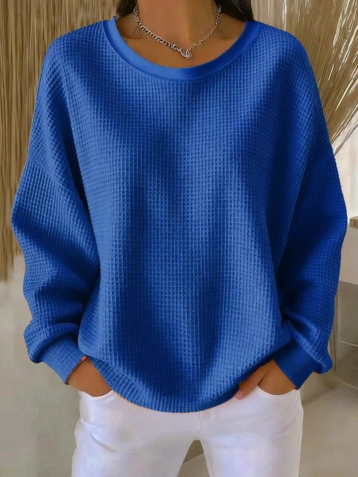 Cobalt blue waffle-knit pullover sweater with oversized silhouette and crew neck