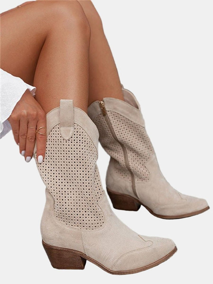 woman wearing beige perforated suede knee-high boots with stacked heel