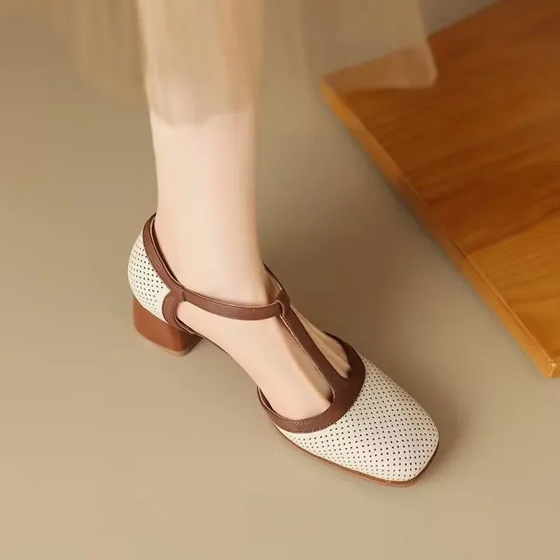 Beige T-strap block heel pump with brown trim shown from above on foot