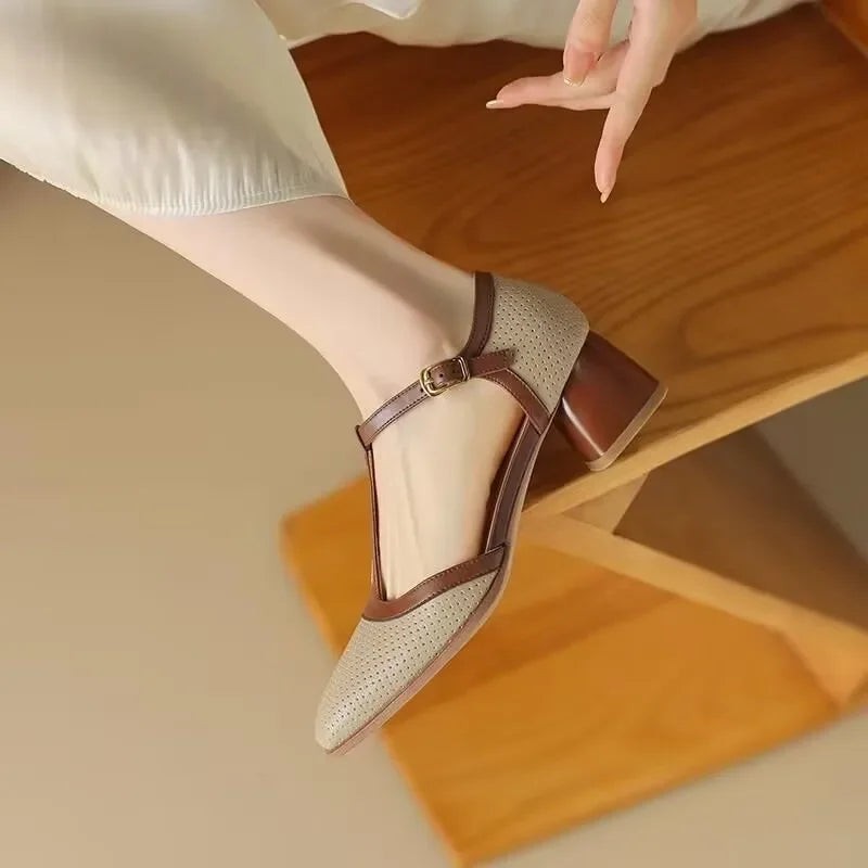Perforated beige mary jane pump with buckled T-strap and brown block heel