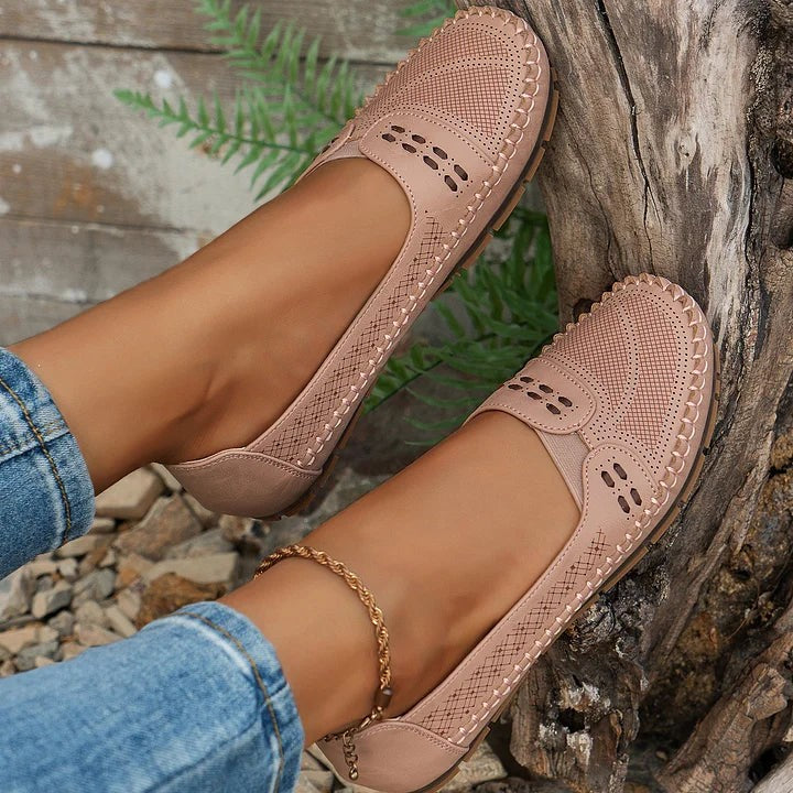 Blush pink perforated loafers paired with cropped jeans and anklet