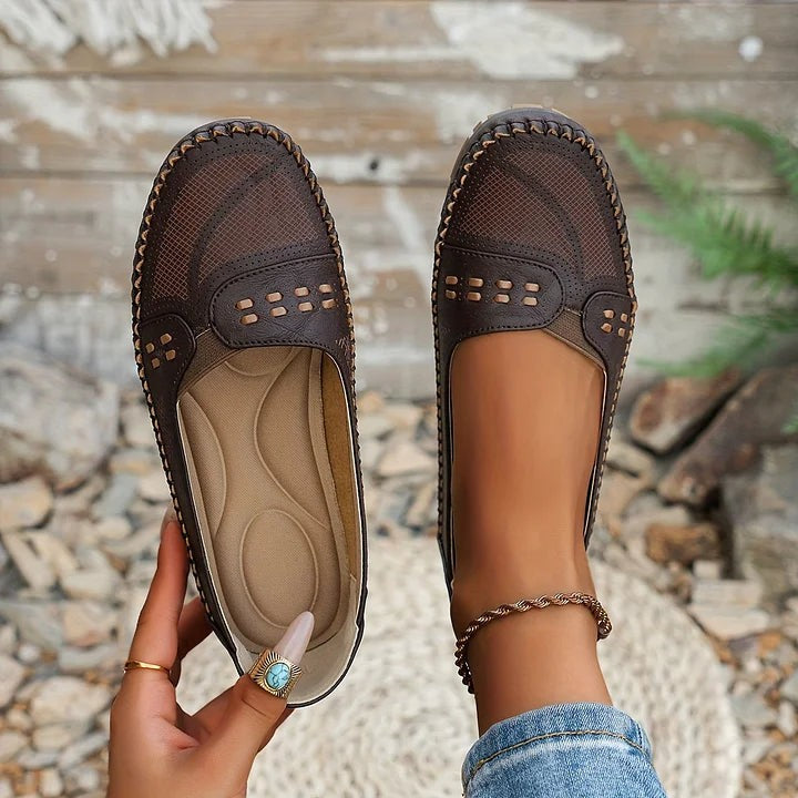 Brown perforated leather loafers with woven texture and cushioned footbed