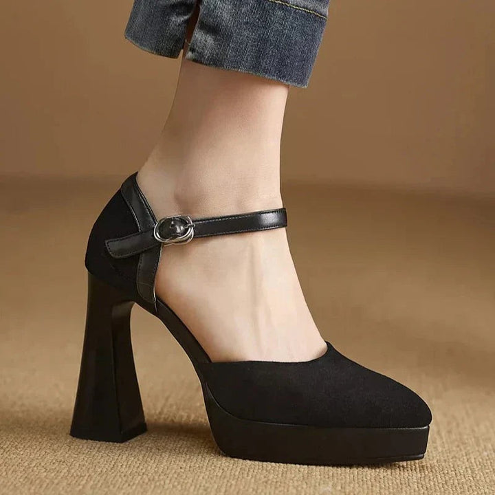 Black suede platform pumps with ankle strap and chunky heel