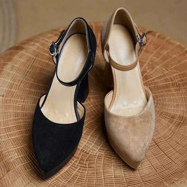 Tan and black suede platform pumps held side by side for comparison