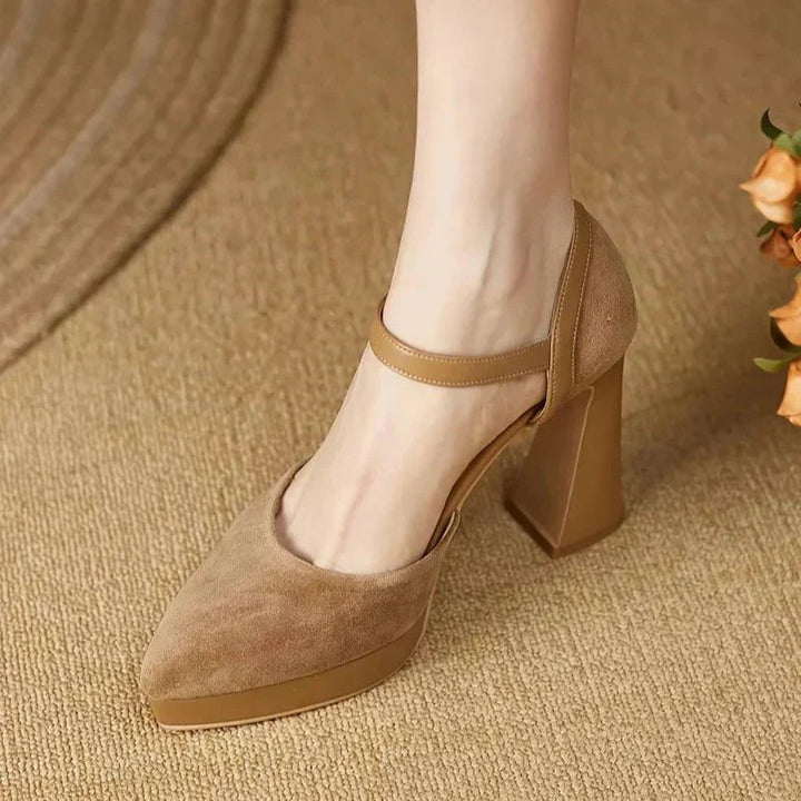 Camel platform pumps worn while walking, showing back heel detail